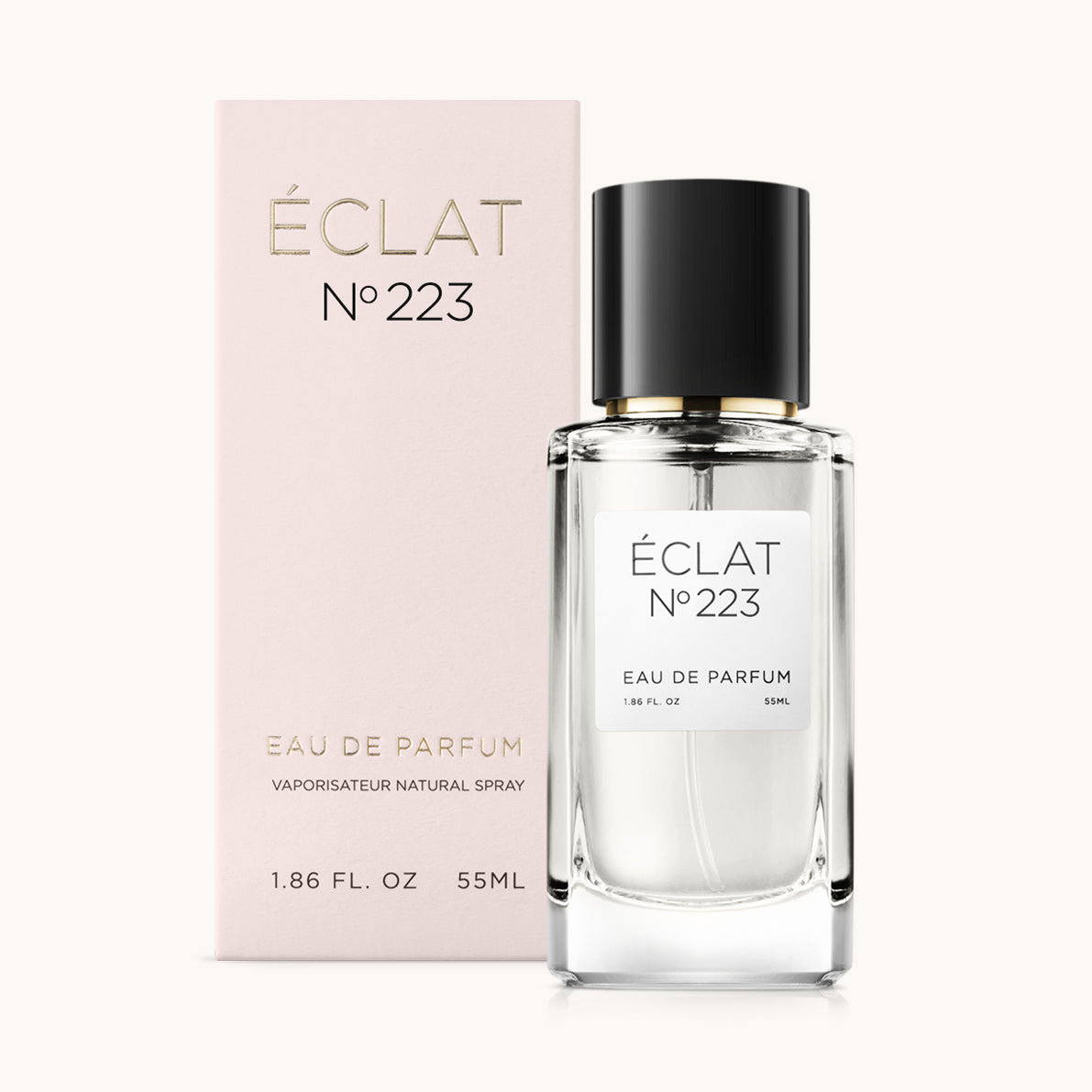 ÉCLAT No. 223 fragrance bottle with matching light pink packaging. The elegant glass flacon features a black cylindrical magnetic cap and a simple white label with the inscription ÉCLAT No. 223 and “Eau de Parfum”.