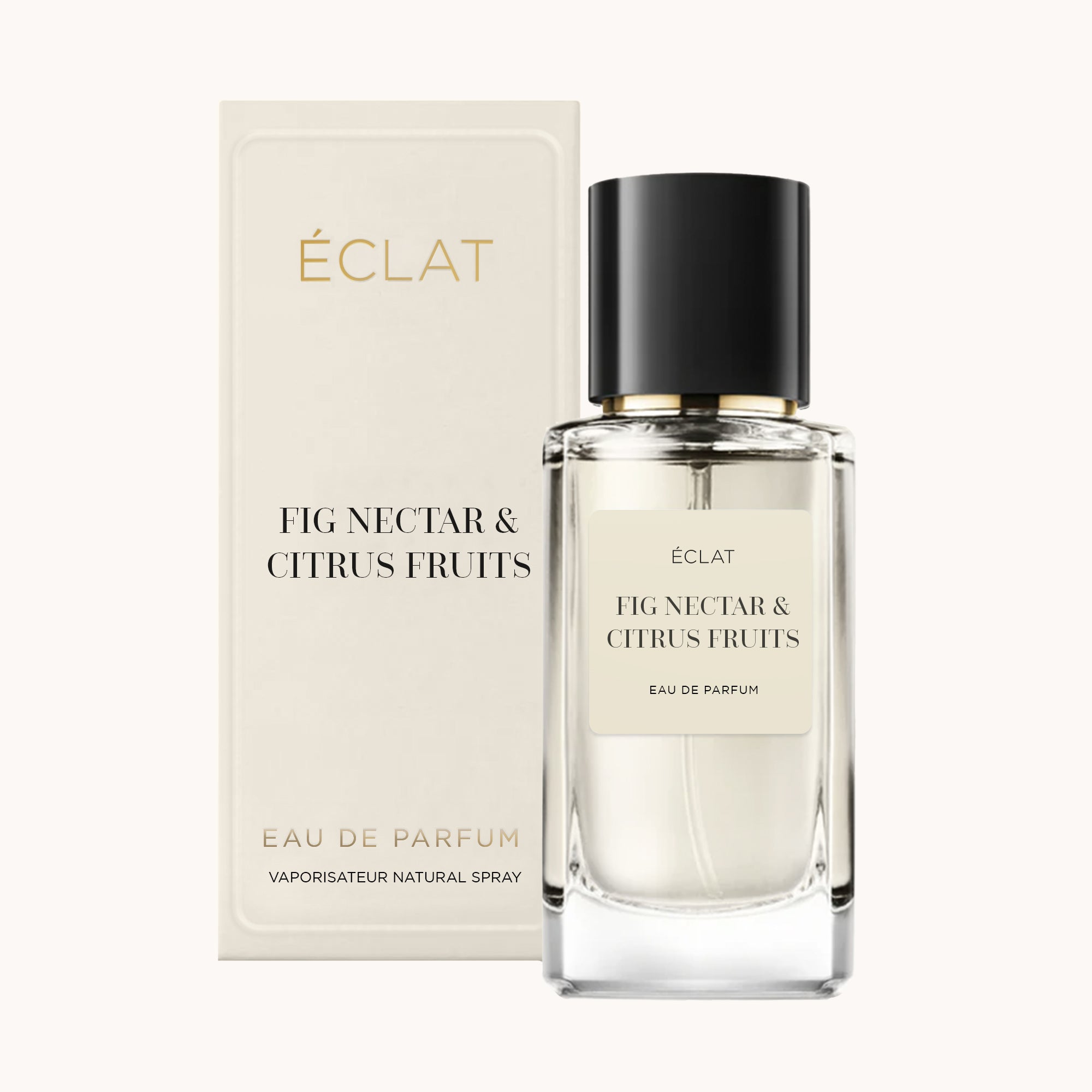 Profumo ÉCLAT Fig Nectar & Citrus Fruits con flacone in vetro trasparente e tappo nero, accanto alla sua elegante scatola color crema.