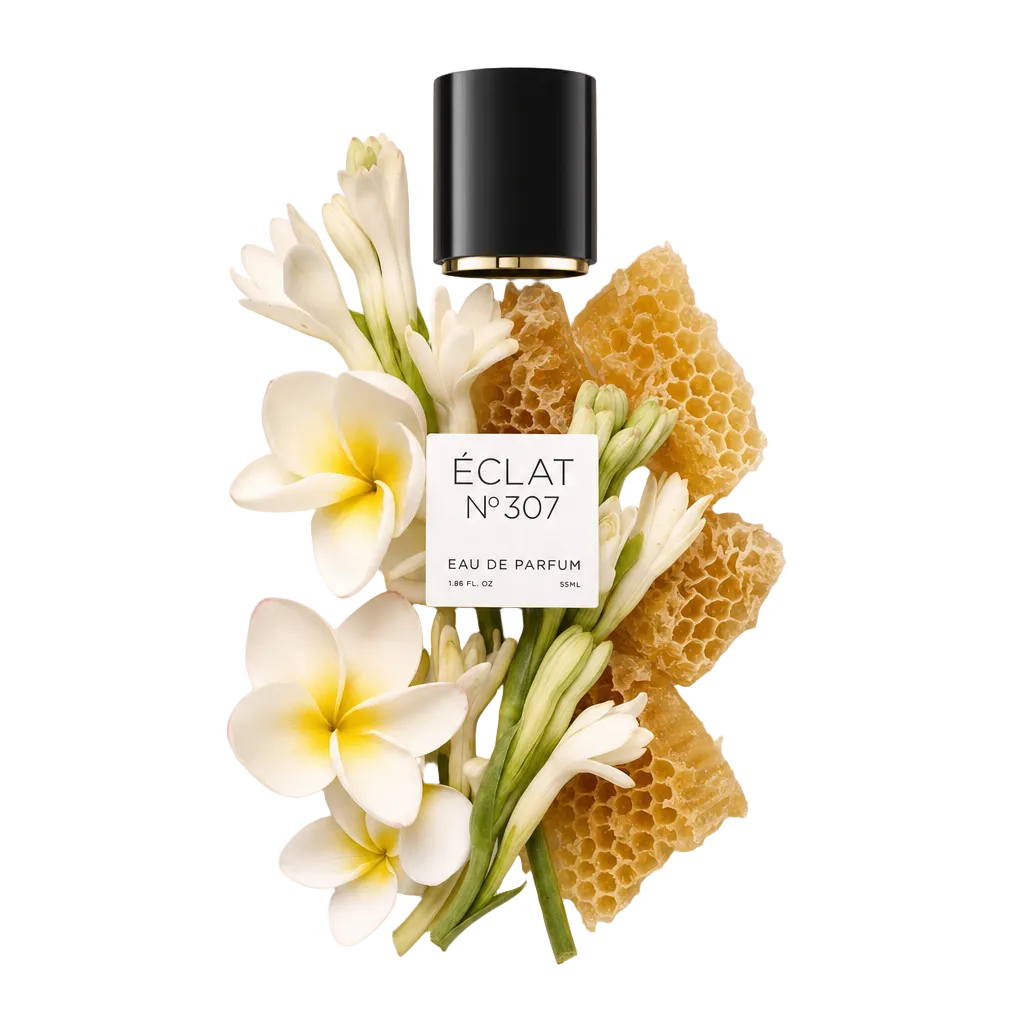 Disposizione di fiori bianchi e favo intorno a un tappo nero con etichetta ÉCLAT Floral Beeswax.