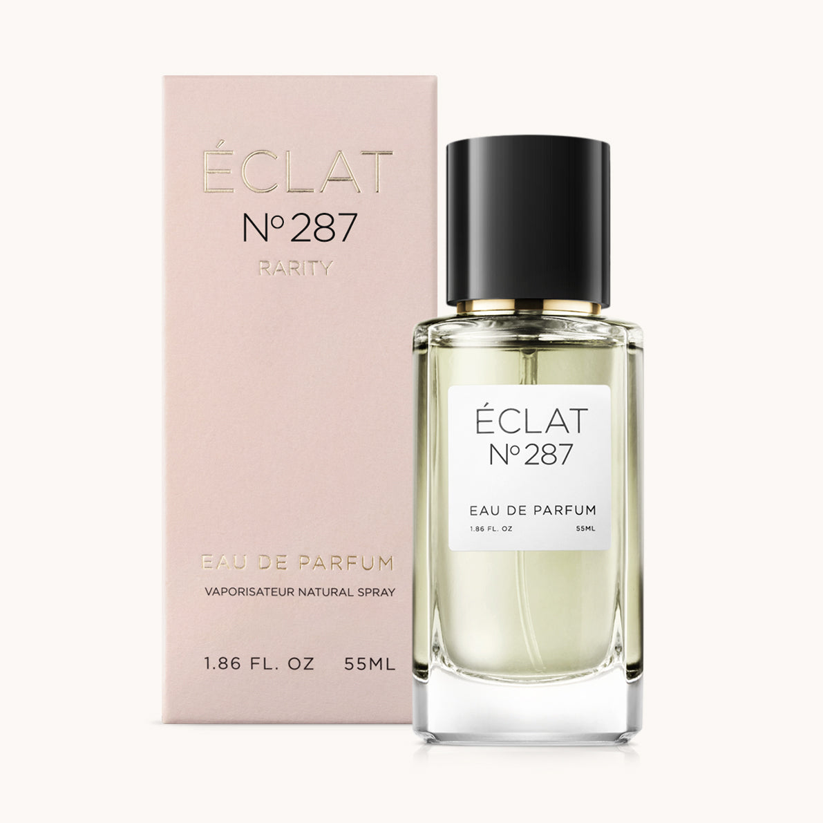 Profumo ÉCLAT Oriental Iris in un flacone di vetro sfaccettato con tappo nero, accanto a una scatola rosa con scritte dorate.