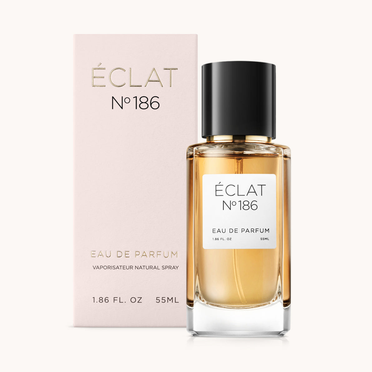 ÉCLAT Powdery Orange Blossom presenta una bottiglia di vetro trasparente con tappo nero, accanto a una scatola color rosa.