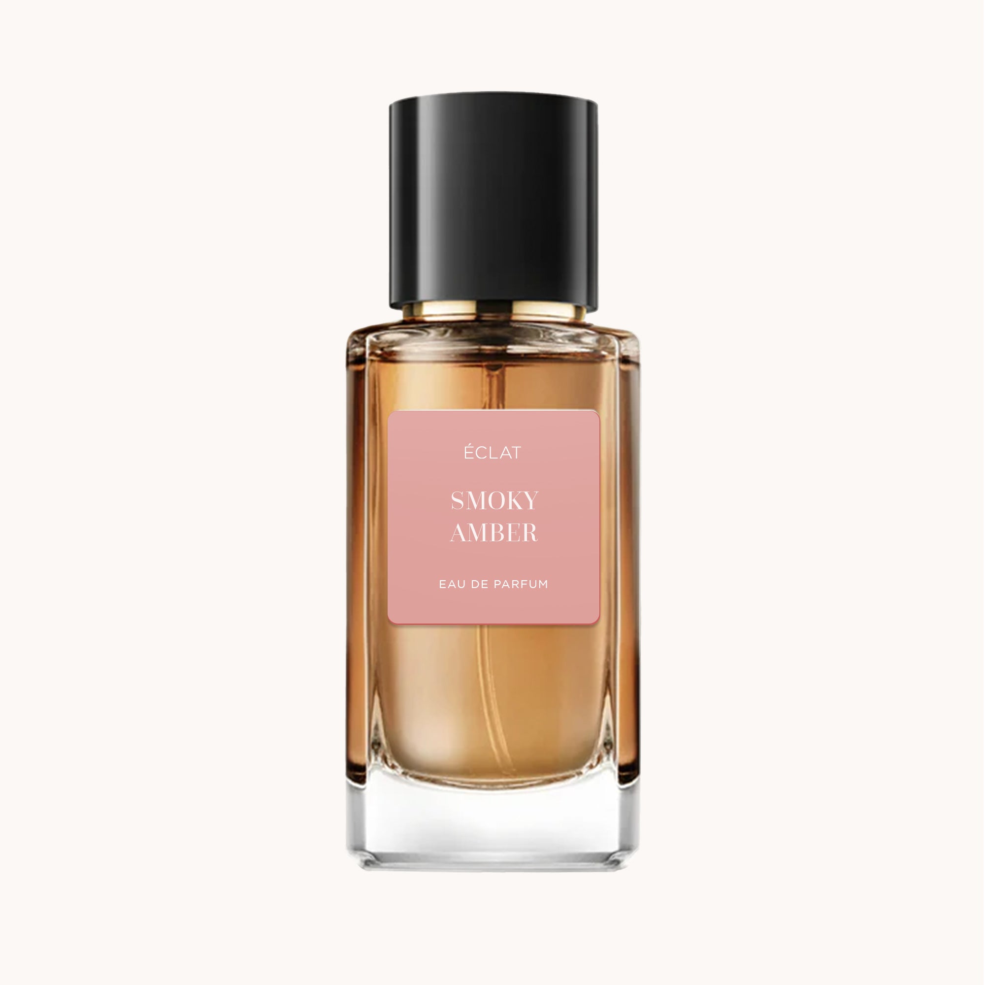 Elegante flacone in vetro di ÉCLAT Smoky Amber con tappo nero e etichetta rosa tenue.