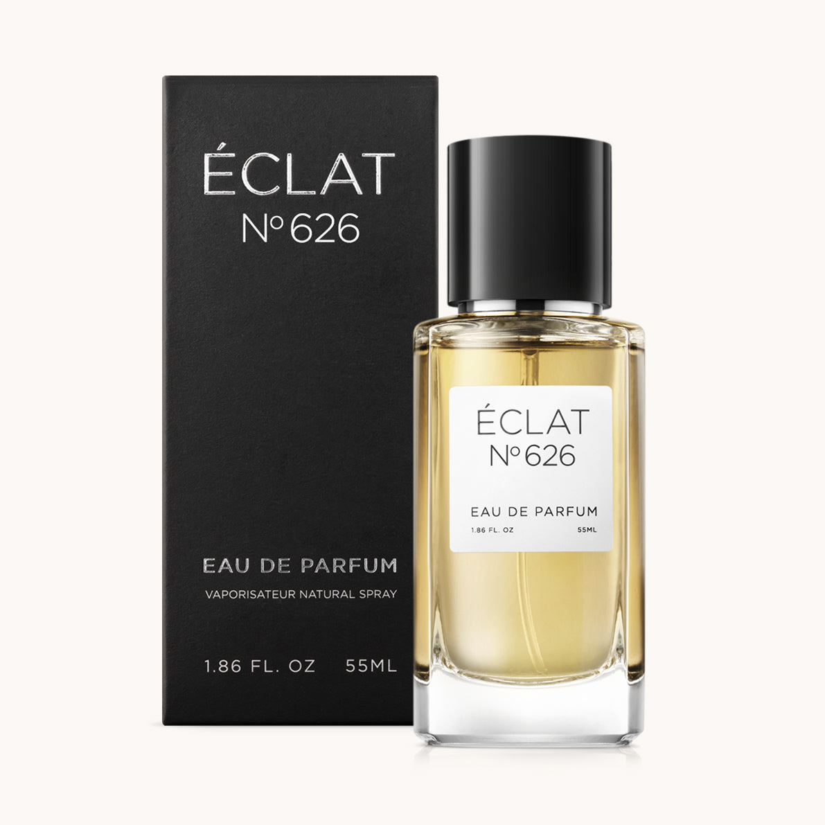 Flacone di profumo ÉCLAT Spicy Blackcurrant con tappo nero elegante e scatola nera.