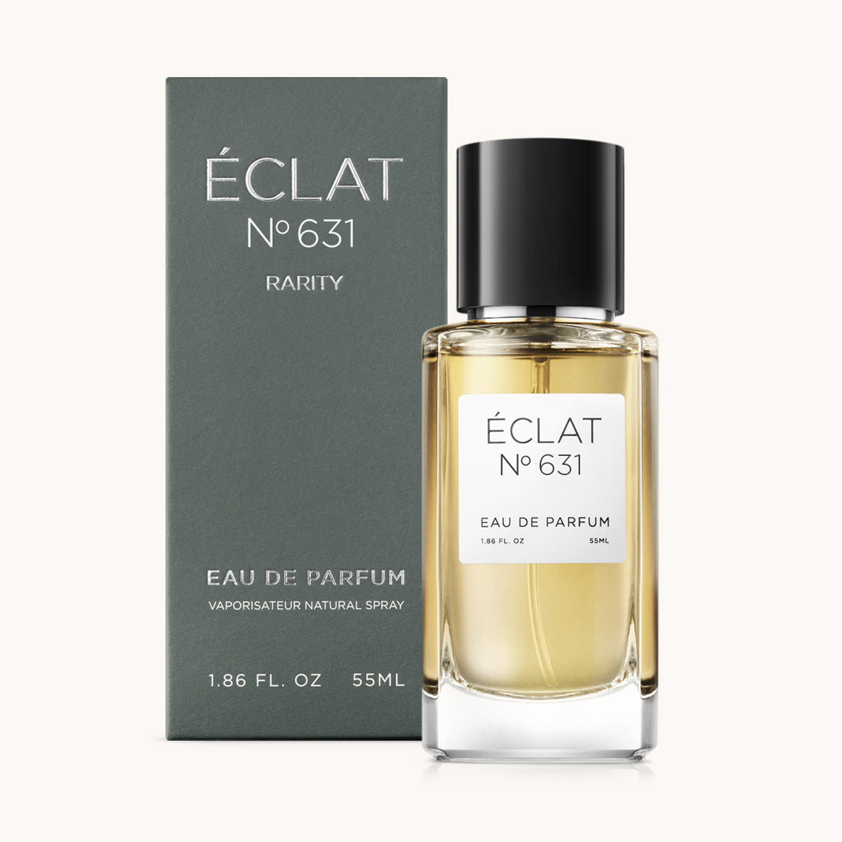 Profumo ÉCLAT Spicy Blood Orange con bottiglia di vetro trasparente e tappo nero, accanto a una scatola scura e opaca.