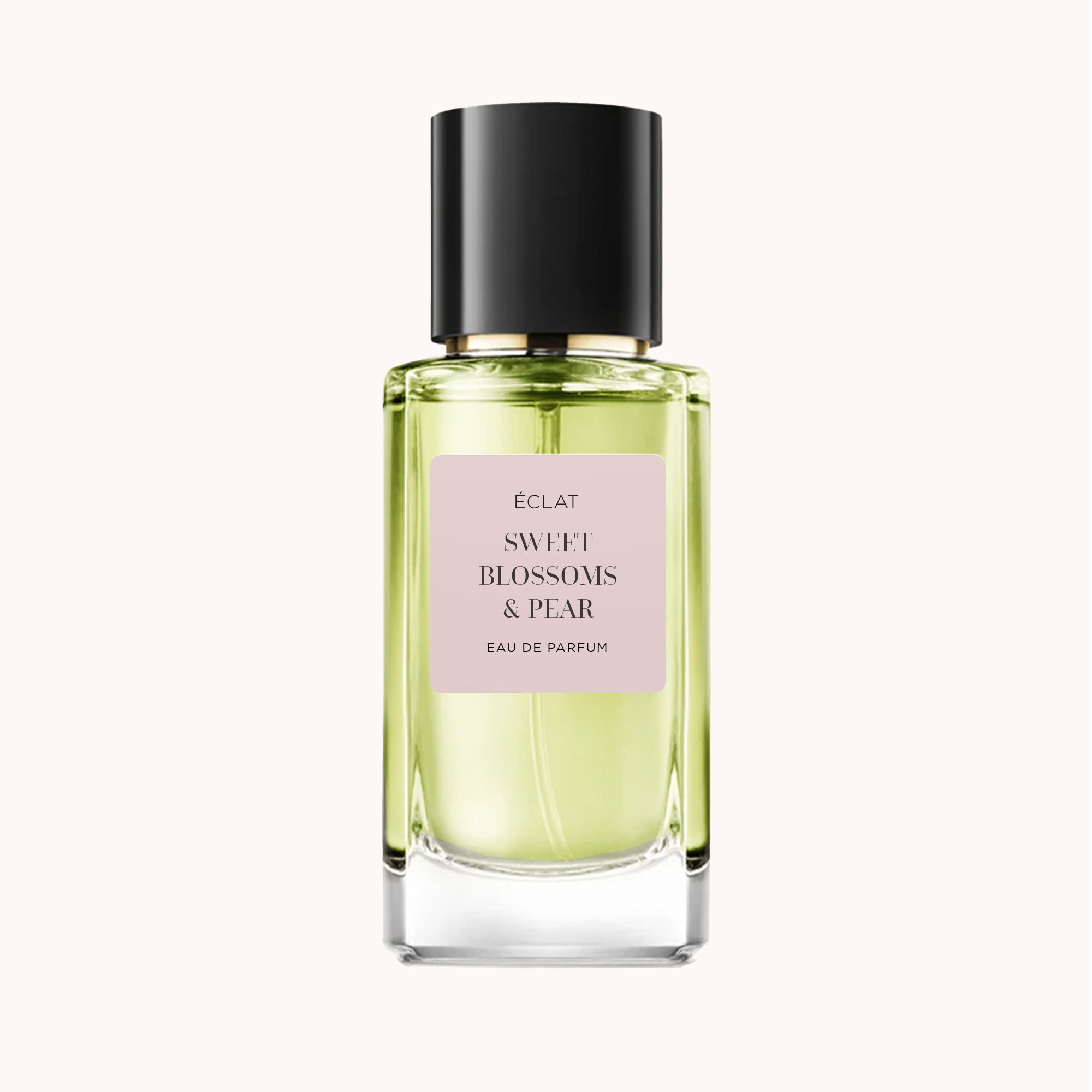 Flacone in vetro sfaccettato con etichetta rosa pallido e tappo nero per ÉCLAT Sweet Blossoms & Pear.