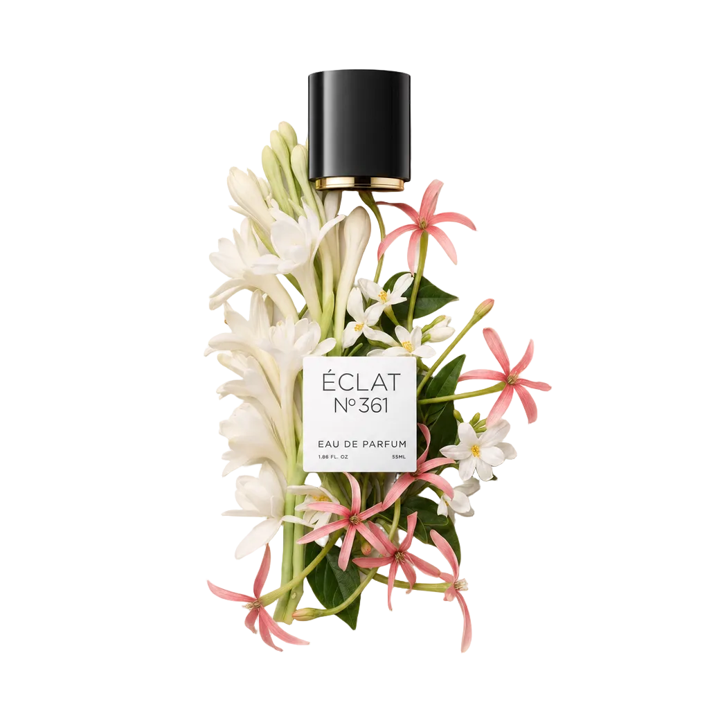 Un arrangiamento di fiori di tuberosa bianca e gelsomino rosa circonda un tappo nero con etichetta ÉCLAT Tuberose & Jasmine.