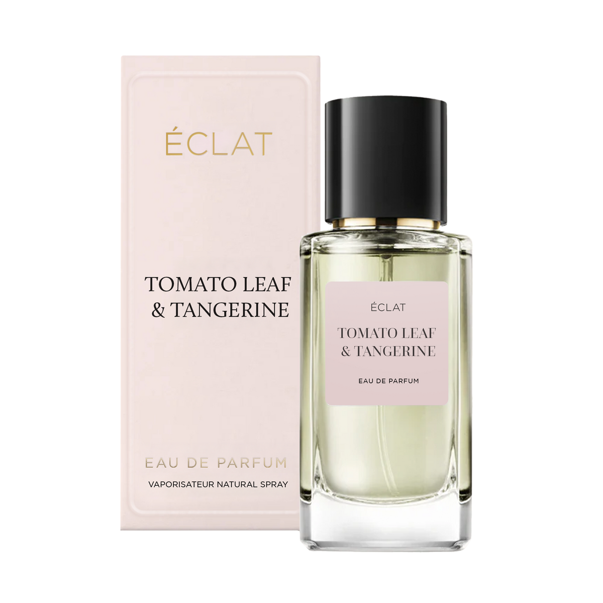 Un flacone di vetro sfaccettato del profumo ÉCLAT Tomato Leaf & Tangerine con tappo nero, accanto alla sua elegante scatola rosa pallido.