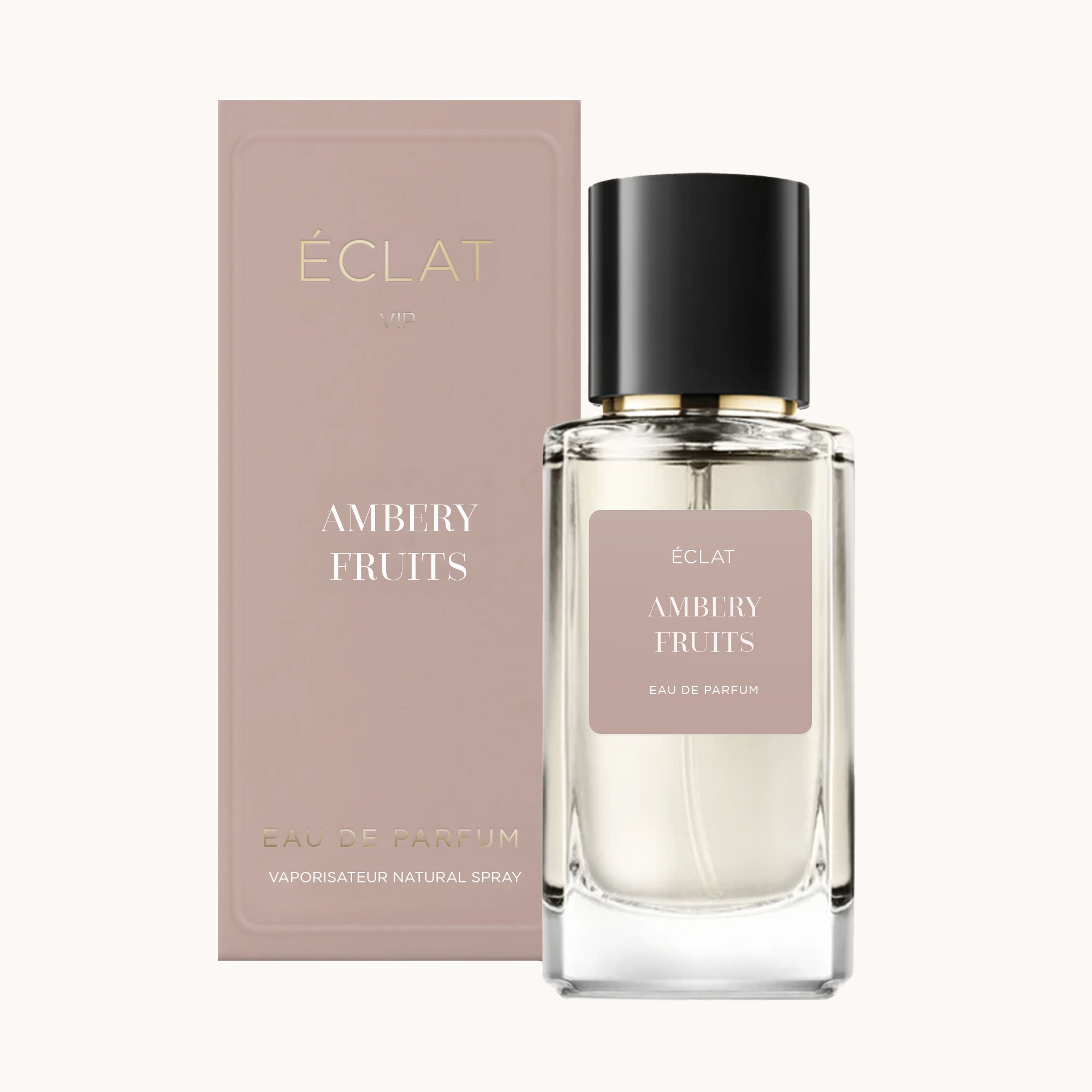 Elegante flacone di vetro con tappo nero, etichetta ÉCLAT Ambery Fruits, accanto a una scatola rosa abbinata.