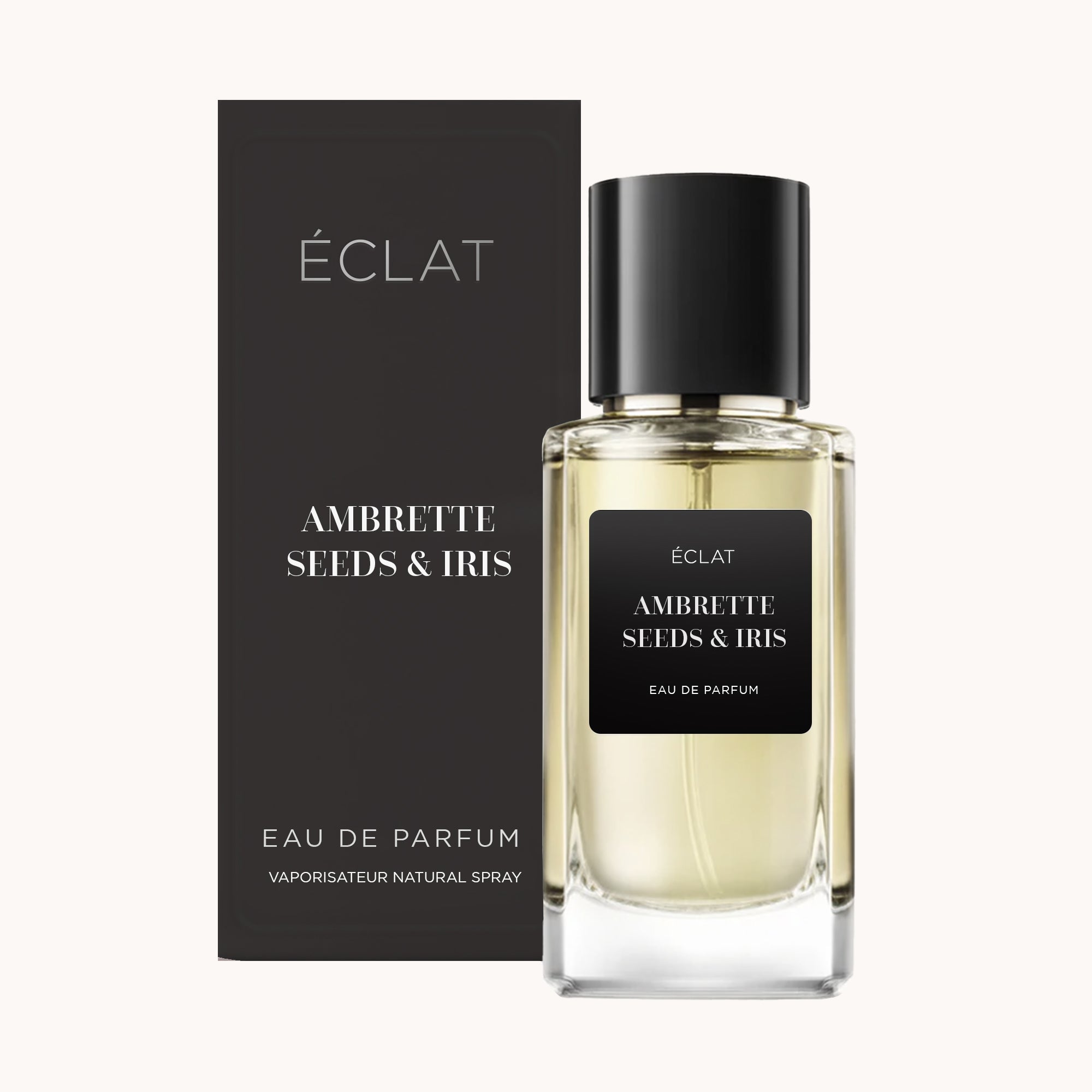 Profumo ÉCLAT Ambrette Seeds & Iris in un flacone di vetro sfaccettato con tappo nero, accompagnato da un'elegante scatola coordinata.