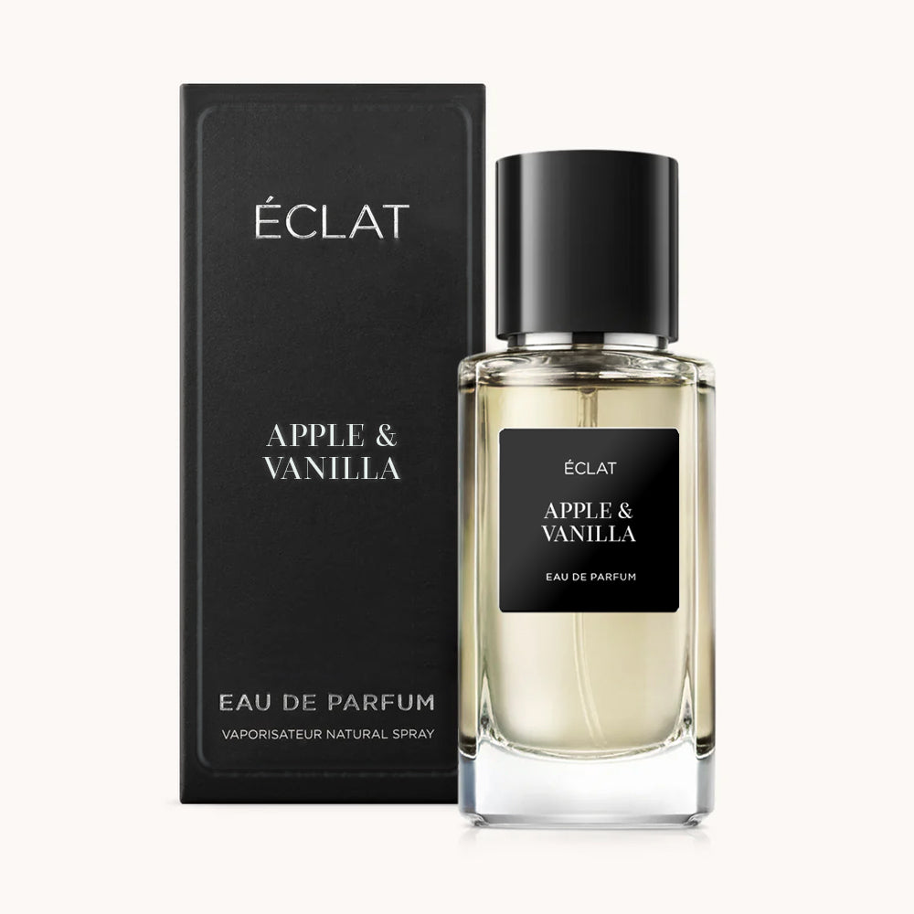 ÉCLAT Apple & Vanilla presenta un elegante flacone di vetro con etichetta nera, accompagnato da un'elegante scatola abbinata.