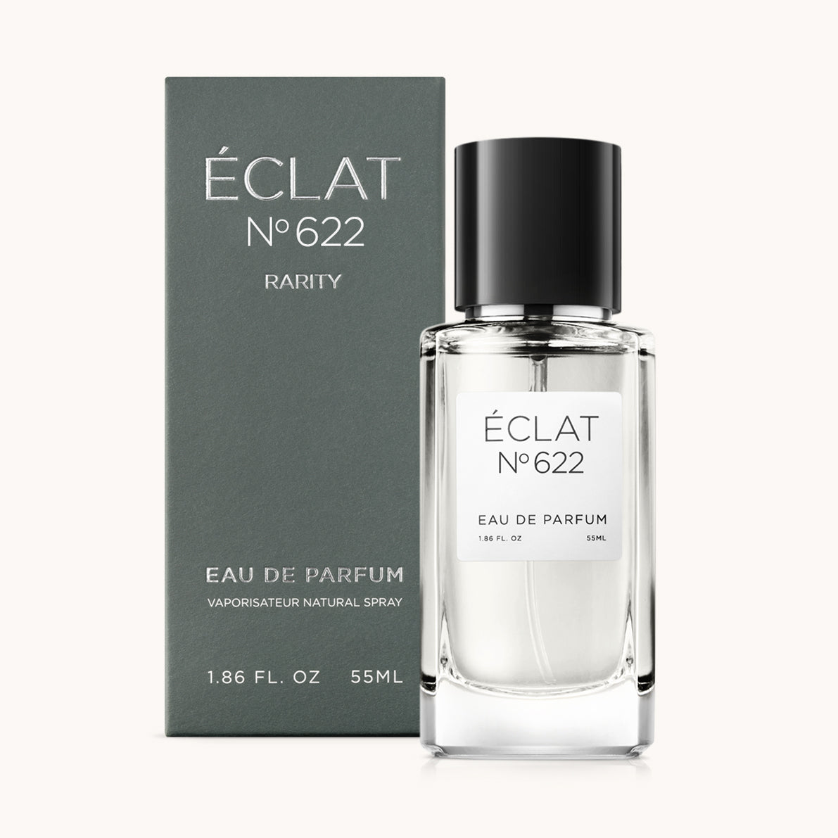 Un flacone in vetro sfaccettato di ÉCLAT Aquatic Lavender con tappo nero, accompagnato da un'elegante scatola grigia.
