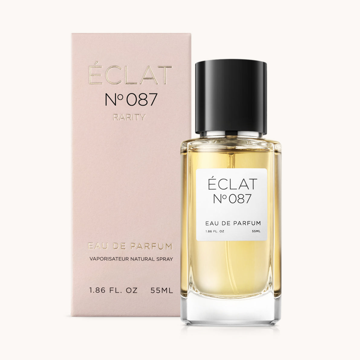 La fragranza ÉCLAT Black Woods è presentata in un flacone di vetro trasparente con tappo nero, accompagnata da una scatola rosa chiaro.