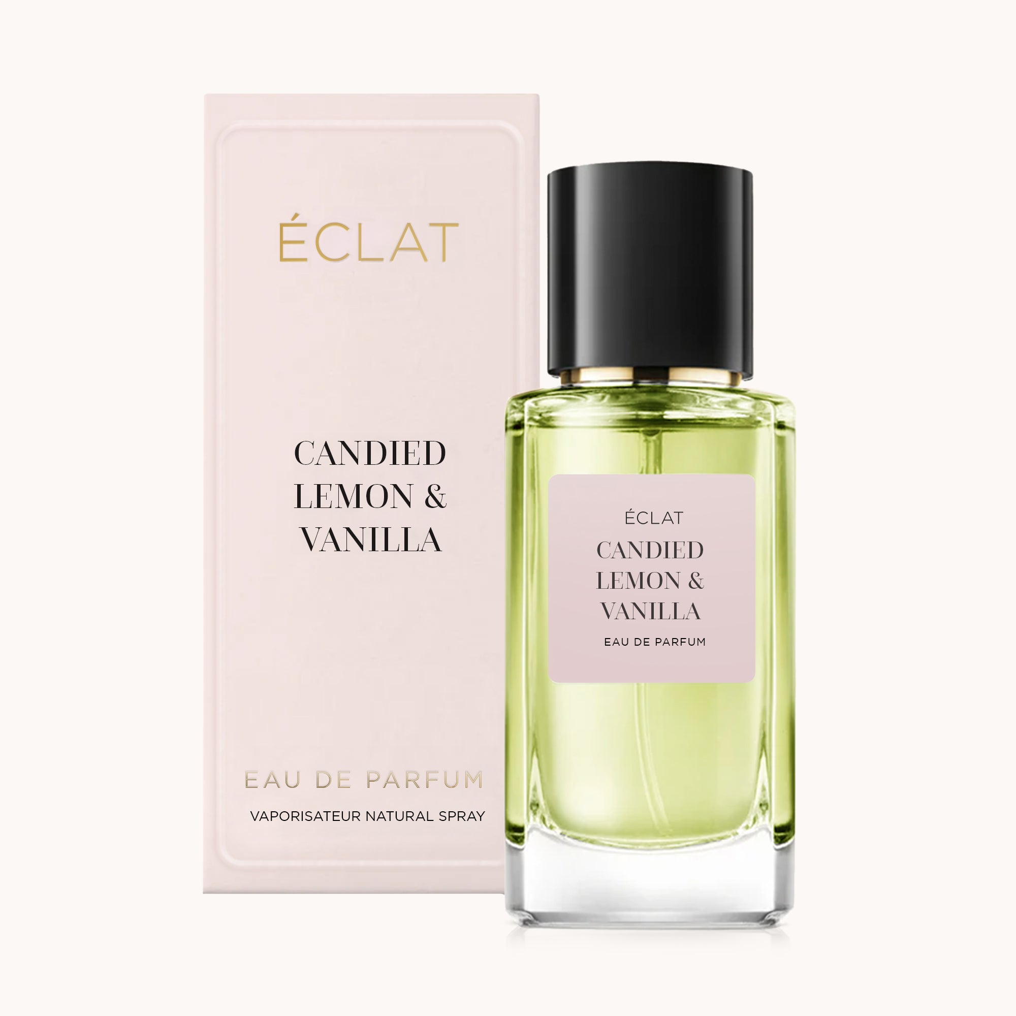 Flacone di profumo ÉCLAT Candied Lemon & Vanilla con scatola rosa pastello e tappo nero.