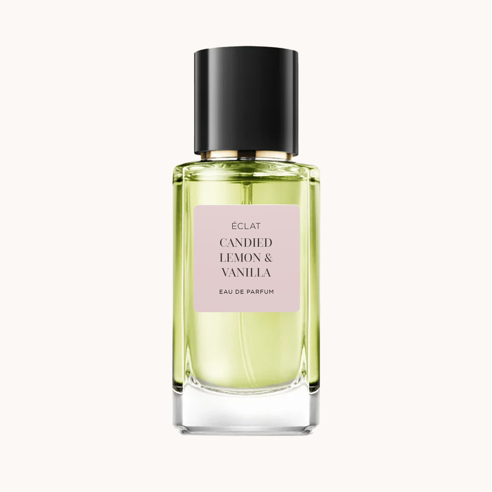 Flacone in vetro sfaccettato di ÉCLAT Candied Lemon & Vanilla con etichetta rosa pallido e tappo nero elegante.