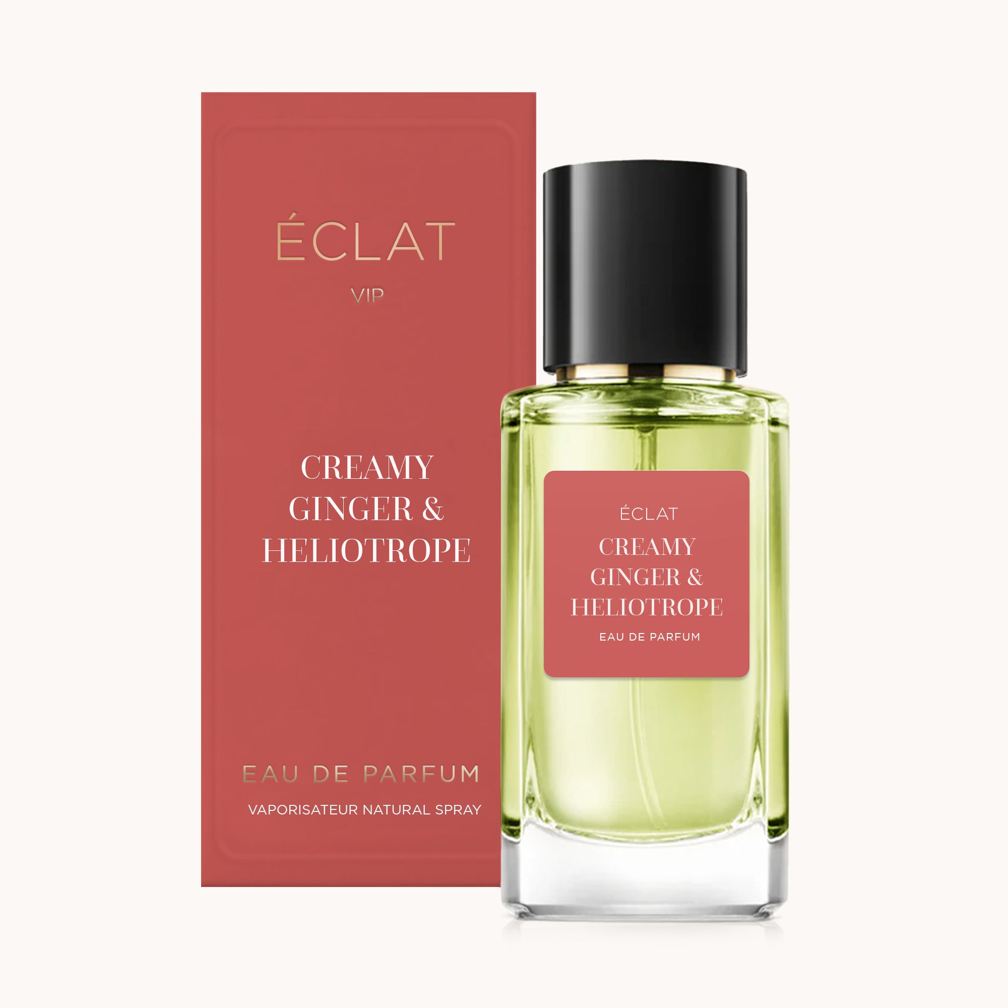 Flacone in vetro sfaccettato con tappo nero e etichetta rossa di ÉCLAT Creamy Ginger & Heliotrope, accanto a una scatola rossa coordinata.