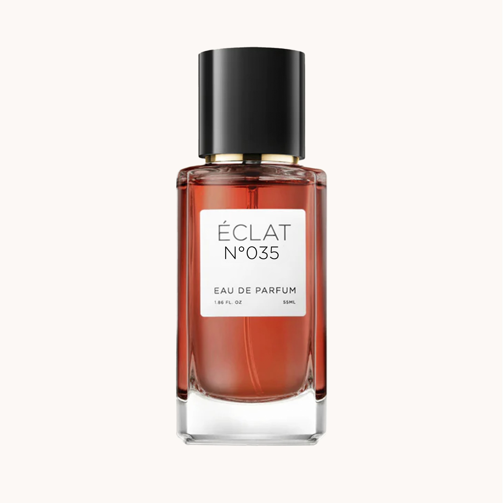 Flacone in vetro sfaccettato con tappo nero, contenente ÉCLAT Creamy Tuberose, con etichetta bianca.