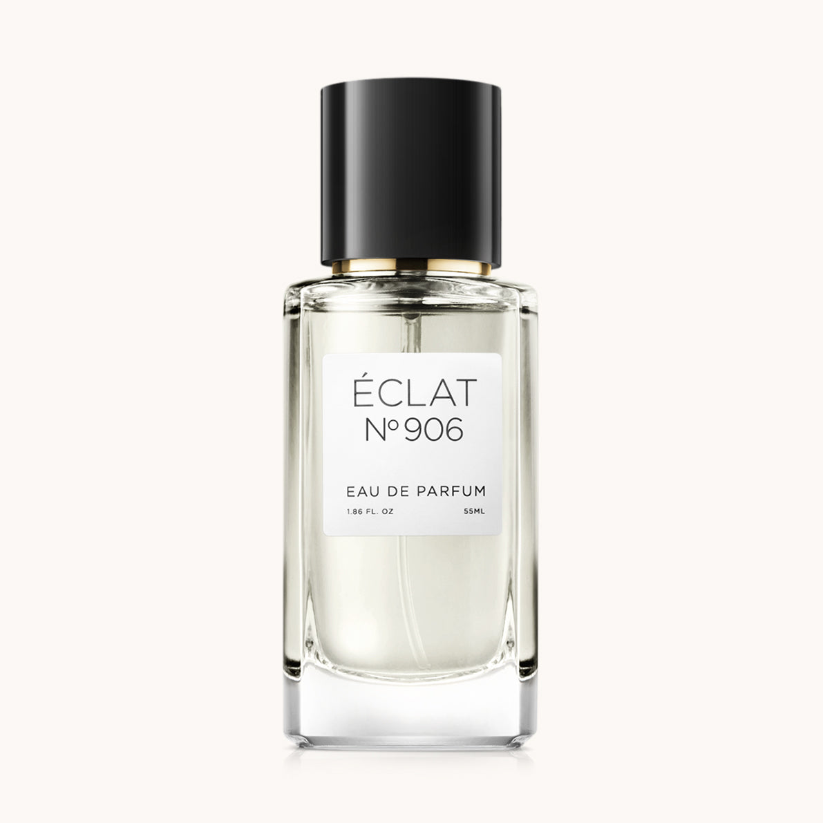 Un flacone in vetro sfaccettato di ÉCLAT Creamy Ylang-Ylang con un elegante tappo nero e un'etichetta bianca semplice.