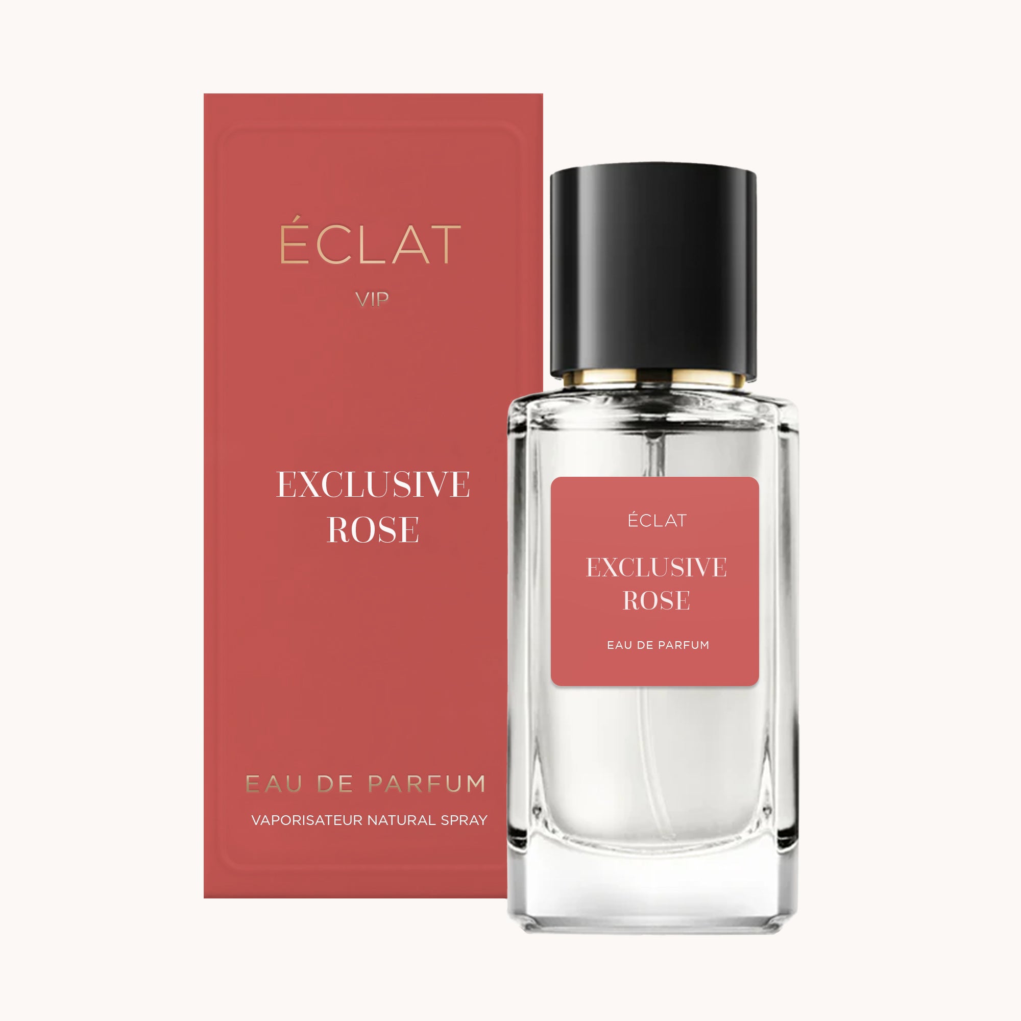 Flacone in vetro sfaccettato con tappo nero e un'etichetta color rosa accanto a una scatola abbinata ÉCLAT EXCLUSIVE ROSE.