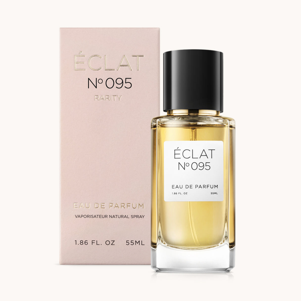 Il profumo ÉCLAT Floral Almond presenta una bottiglia in vetro trasparente con tappo nero accanto a una scatola rosa pallido con lettere dorate.