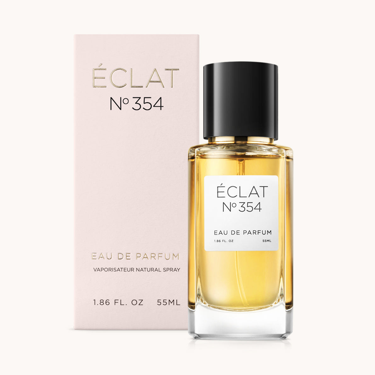 Bottiglia di profumo ÉCLAT Floral Ginger con tappo nero e scatola rosa chiaro.