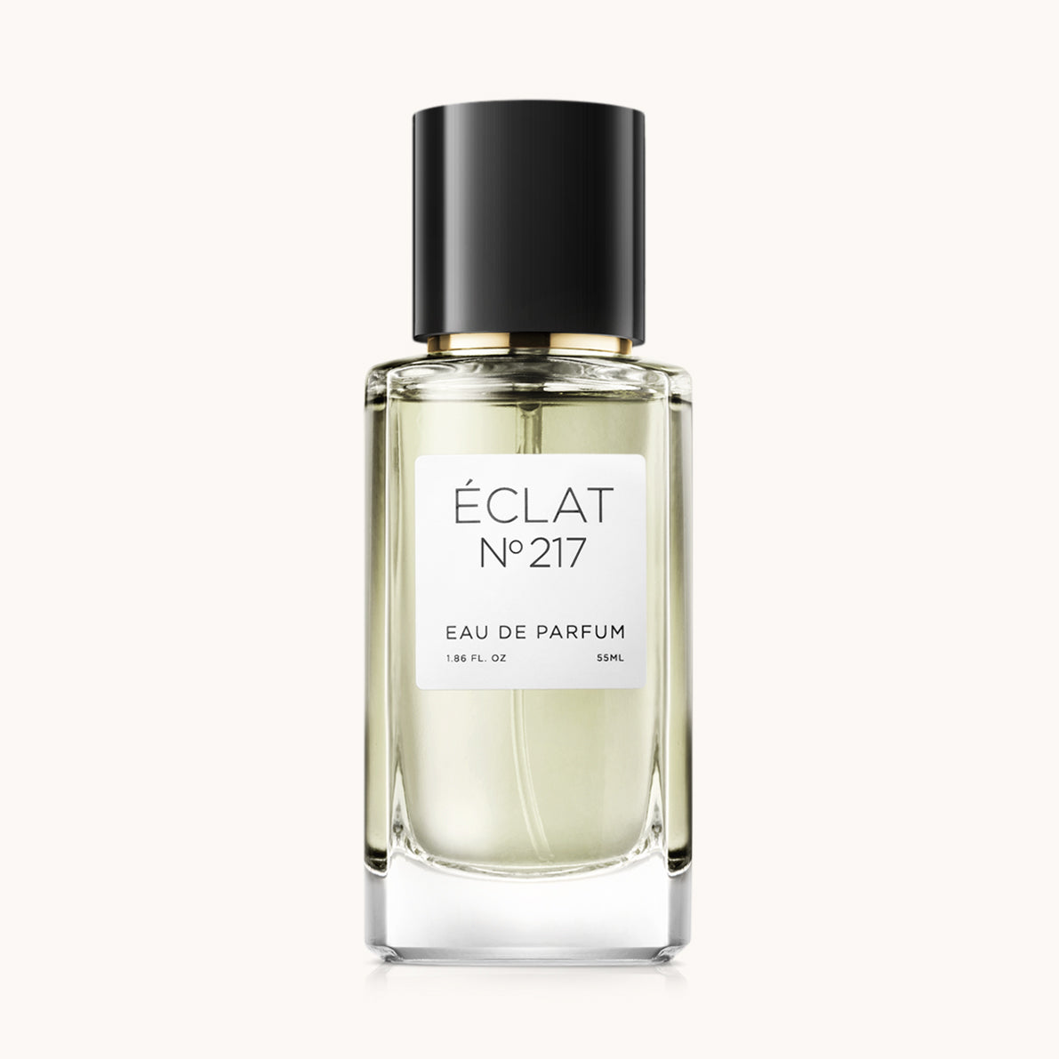 Bottiglia di profumo ÉCLAT Floral Honey con design in vetro sfaccettato trasparente e tappo nero.
