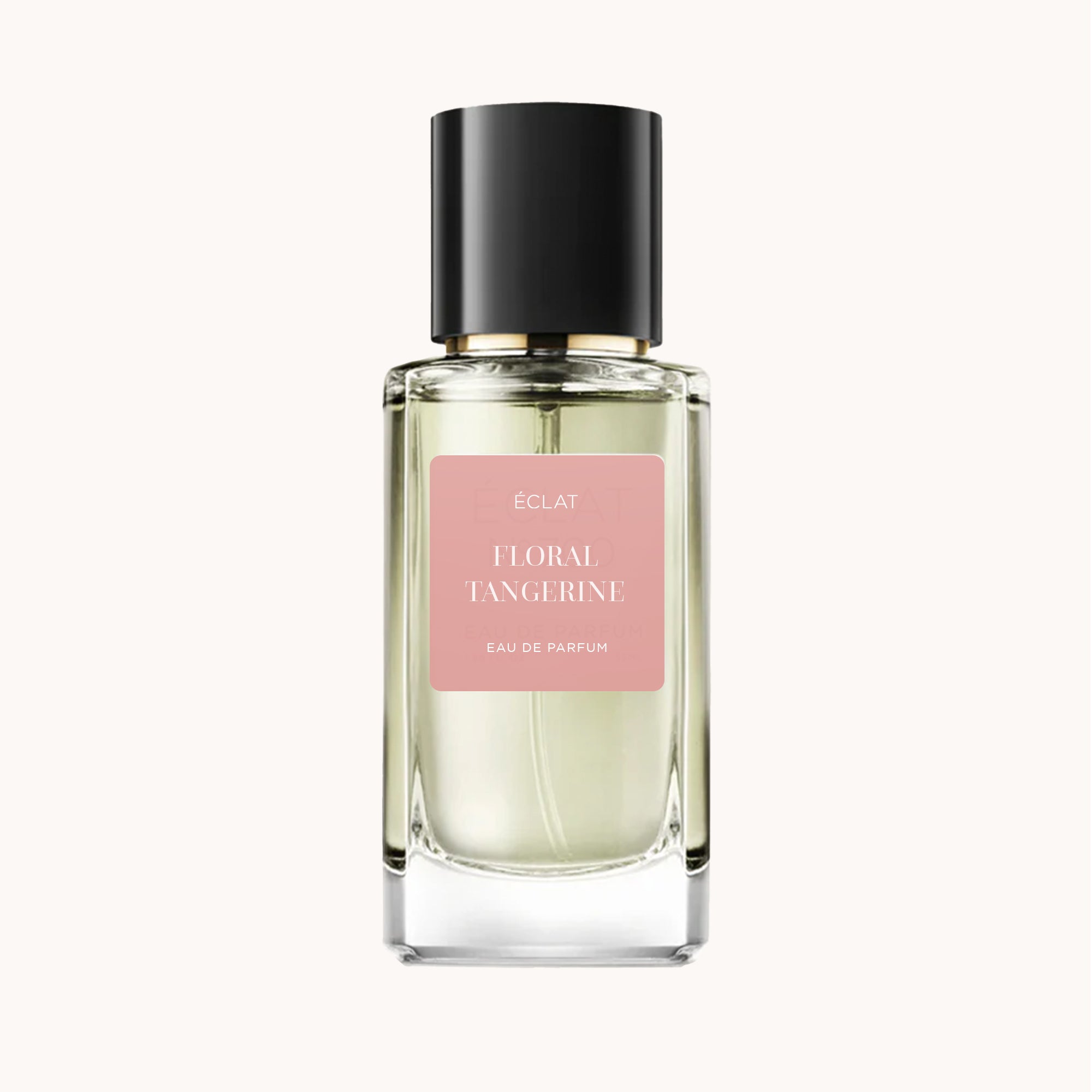 ÉCLAT Floral Tangerine è presentato in un flacone di vetro sfaccettato con un elegante tappo nero e un'etichetta rosa tenue.
