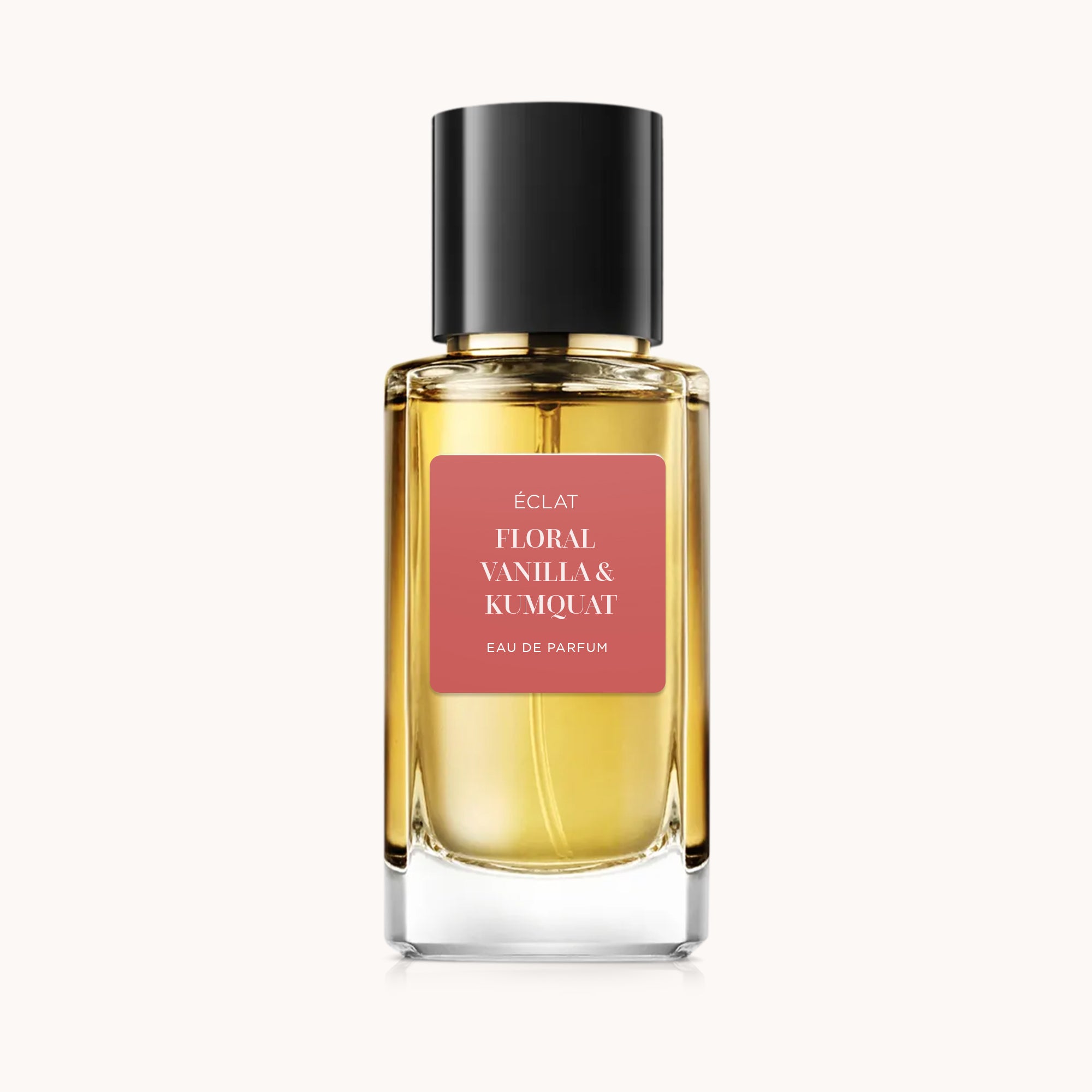 ÉCLAT Floral Vanilla & Kumquat in un flacone di vetro sfaccettato con tappo nero e etichetta satinata.