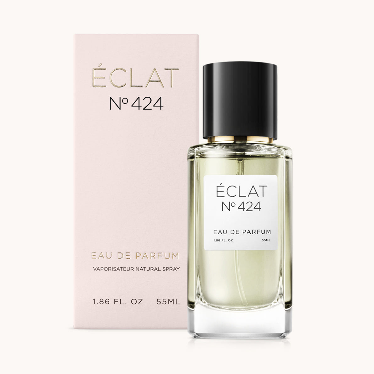 Bottiglia di profumo ÉCLAT Fruity Vanilla con vetro trasparente e tappo nero, accanto a una scatola rosa pallido.