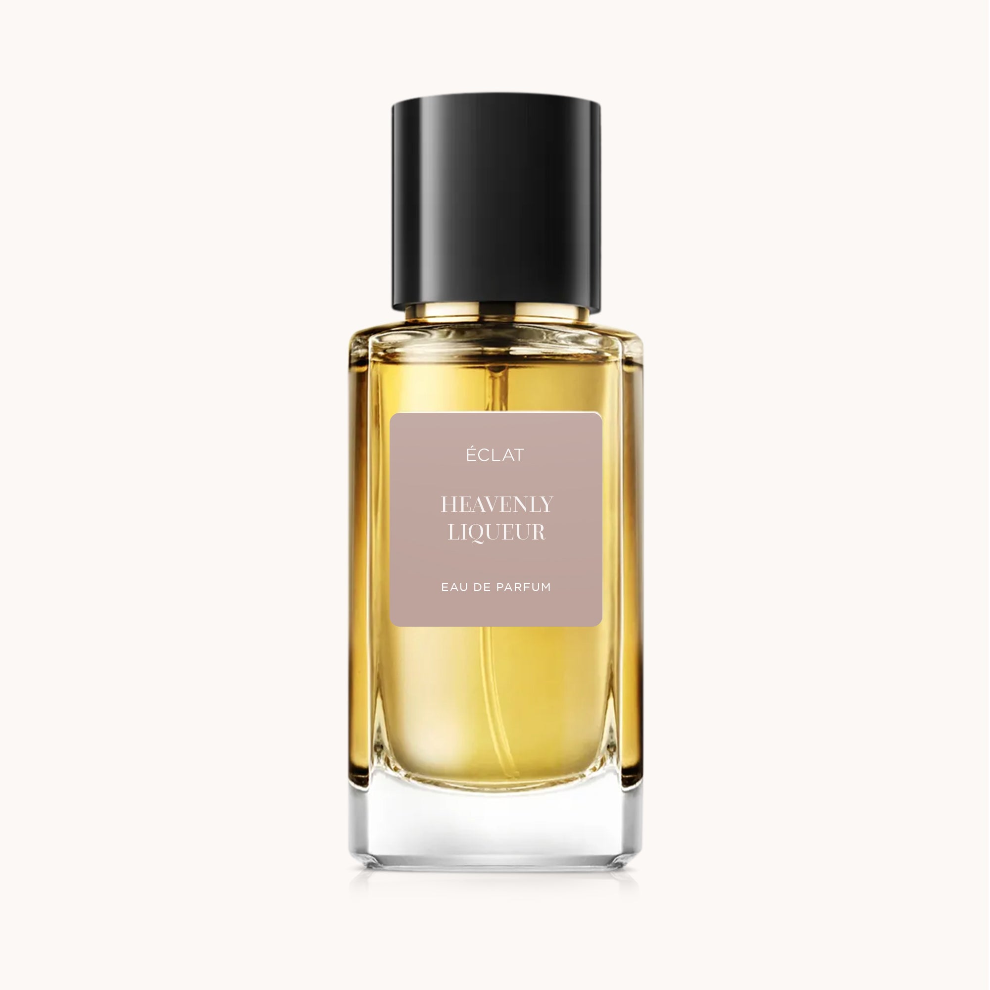 Flacone in vetro sfaccettato di ÉCLAT Heavenly Liqueur con tappo nero elegante e etichetta discreta.