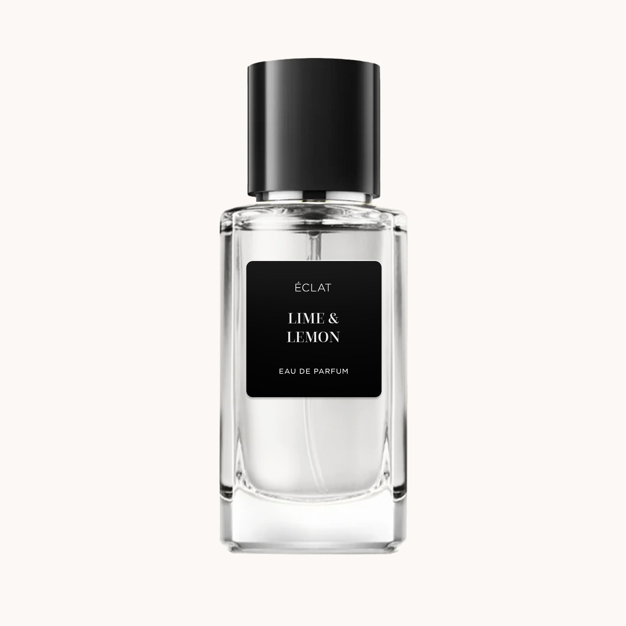 Profumo ÉCLAT Lime & Lemon in flacone di vetro trasparente con tappo nero e etichetta nera su sfondo chiaro.