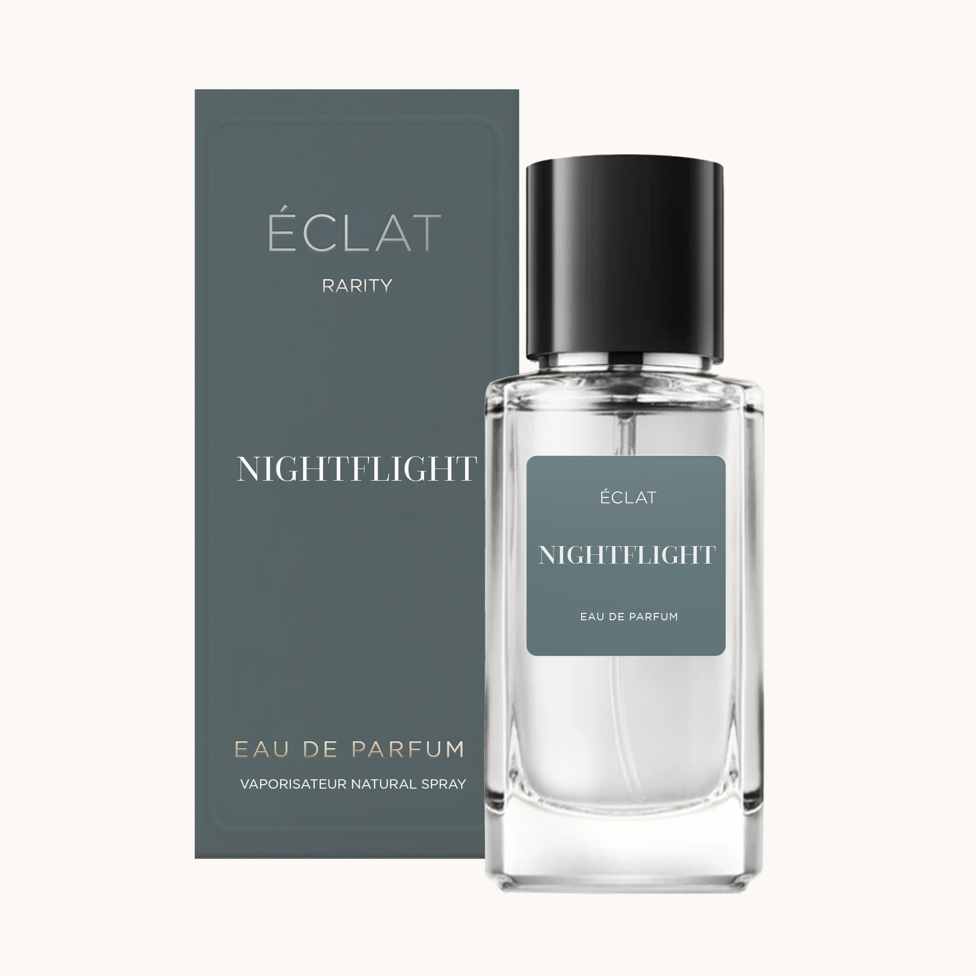 La fragranza ÉCLAT Nightflight è contenuta in un flacone di vetro trasparente con un elegante tappo nero, accompagnato da una scatola grigio scuro.