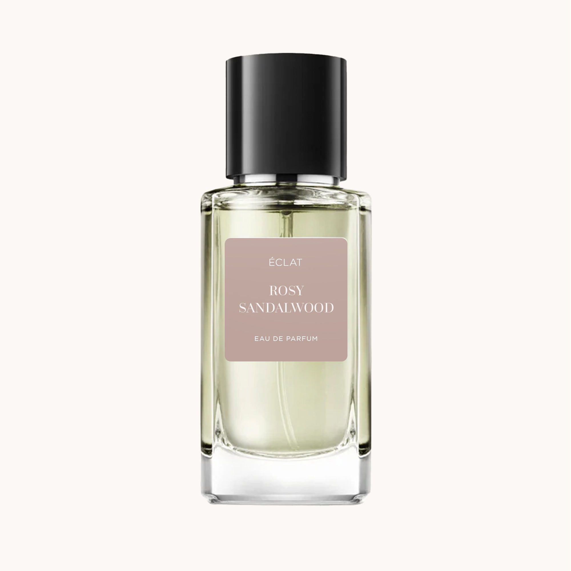 ÉCLAT Rosy Sandalwood VIP in un flacone di vetro sfaccettato con tappo nero opaco e etichetta rosa tenue.
