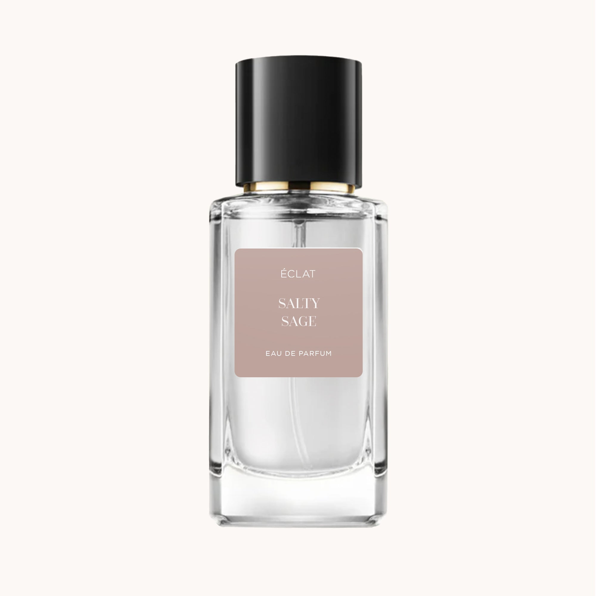 Una bottiglia di vetro sfaccettato trasparente di ÉCLAT Salty Sage con tappo nero e etichetta beige.
