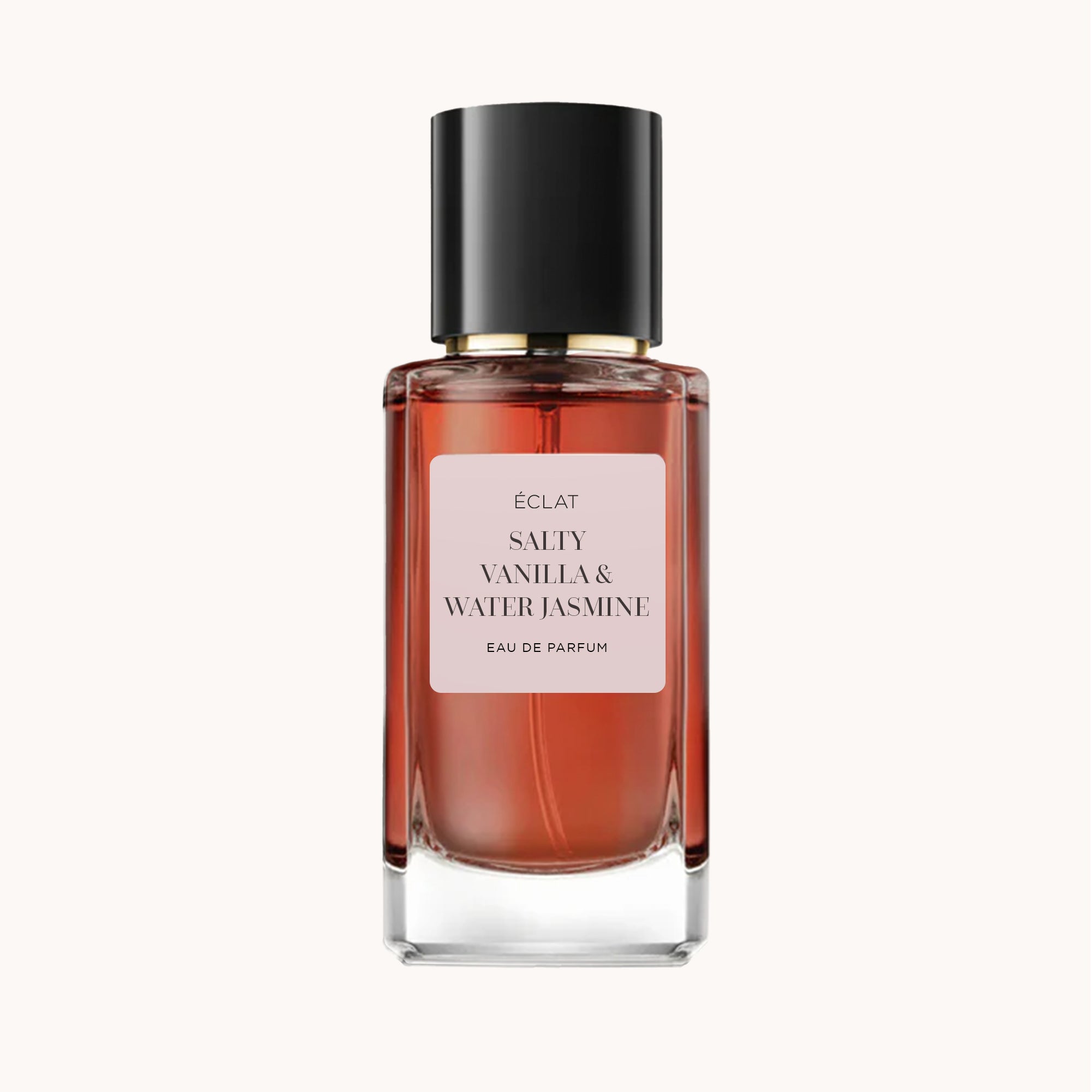 ÉCLAT Salty Vanilla & Water Jasmine in un flacone di vetro sfaccettato con tappo nero.