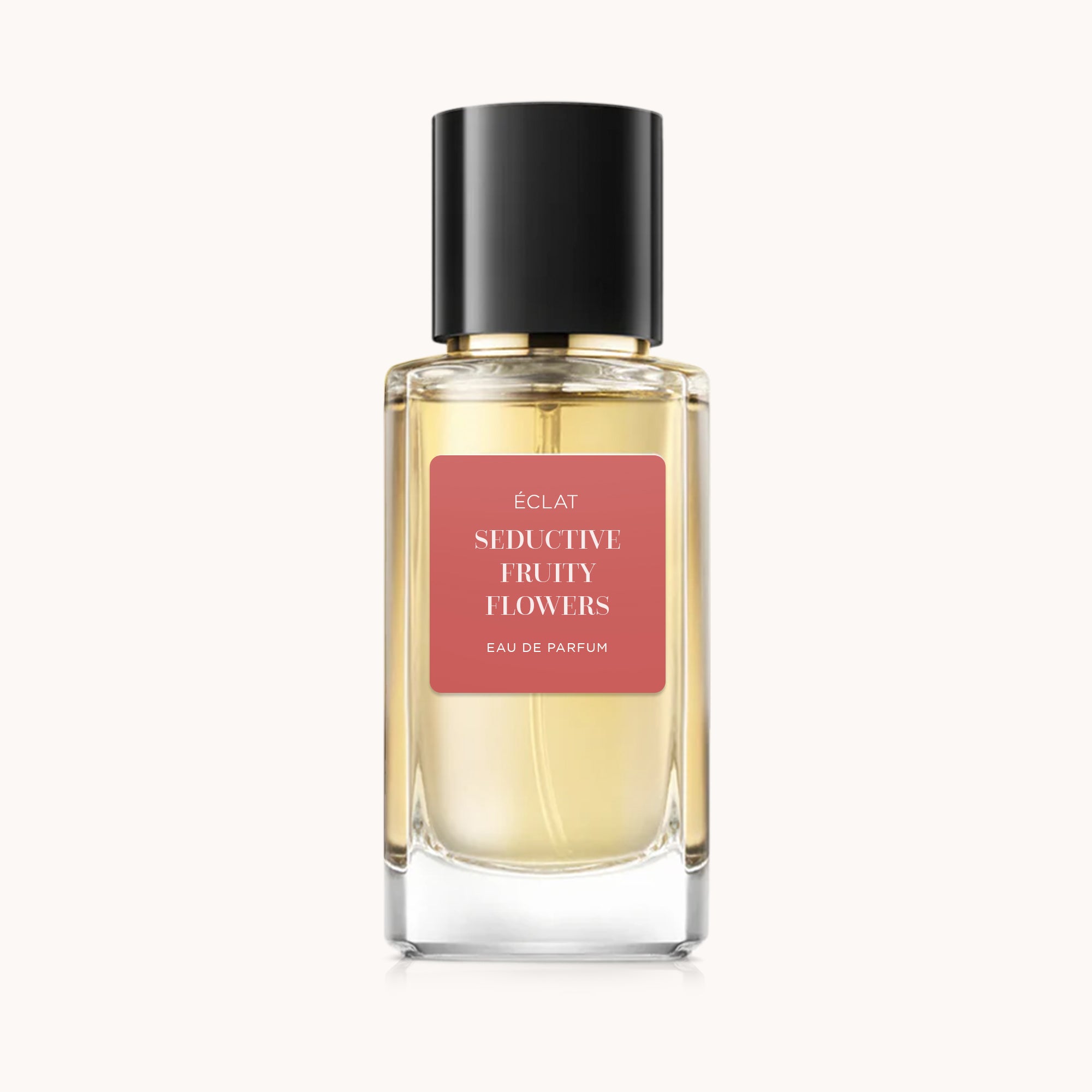 ÉCLAT Seductive Fruity Flowers in un flacone di vetro sfaccettato con tappo nero ed etichetta rosa.