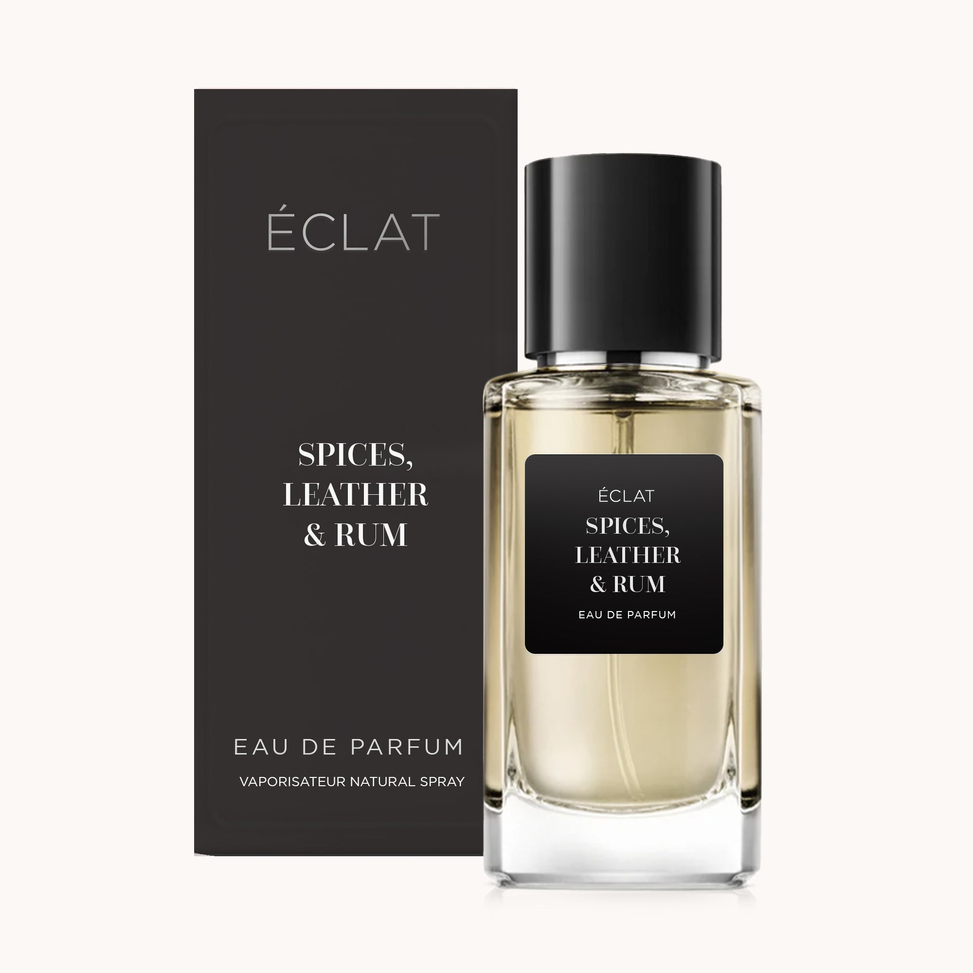 Flacone di vetro sfaccettato di ÉCLAT Spices, Leather & Rum con tappo nero ed etichetta opaca, accanto a una scatola di presentazione abbinata.