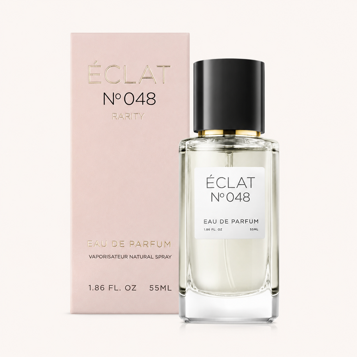 Flacone in vetro sfaccettato di ÉCLAT Sweet Blackcurrant con tappo nero, accanto a una scatola rosa che mostra il nome del marchio.