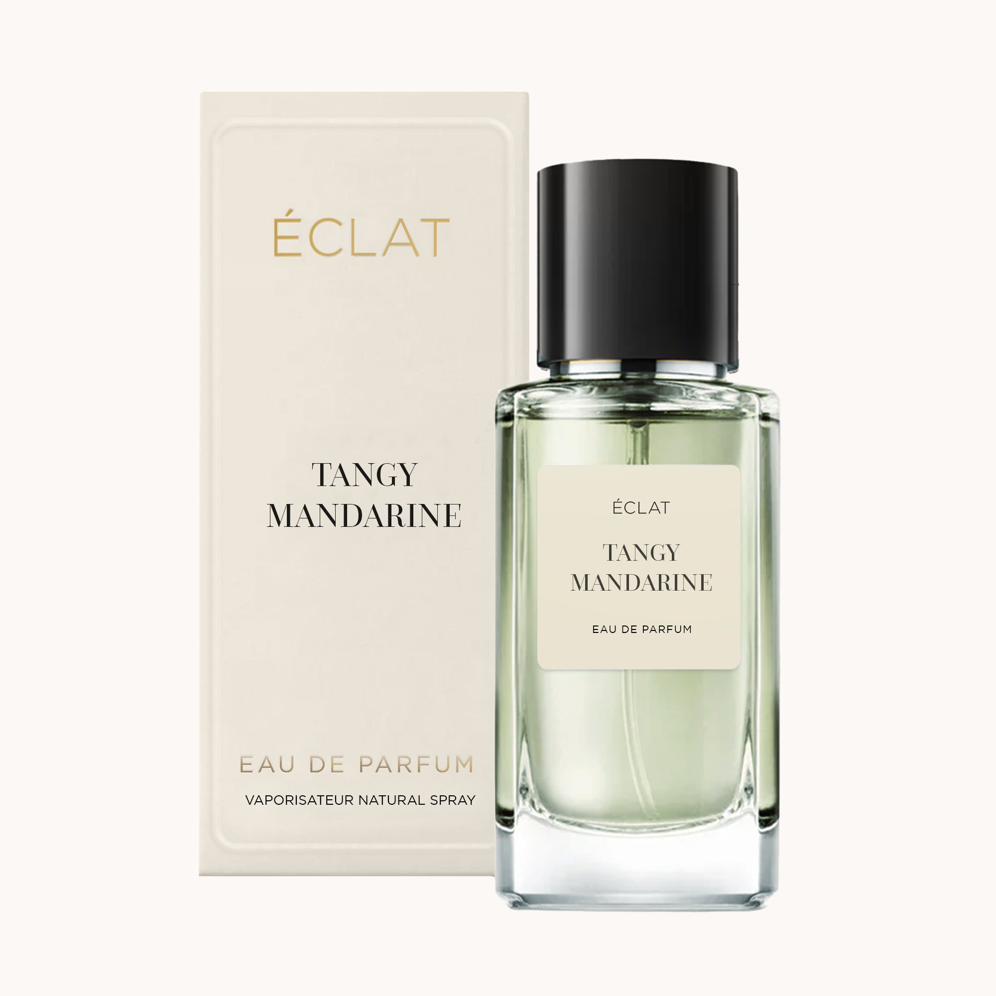 Flacone in vetro sfaccettato di ÉCLAT Tangy Mandarin con tappo nero, accanto alla sua elegante scatola color crema.